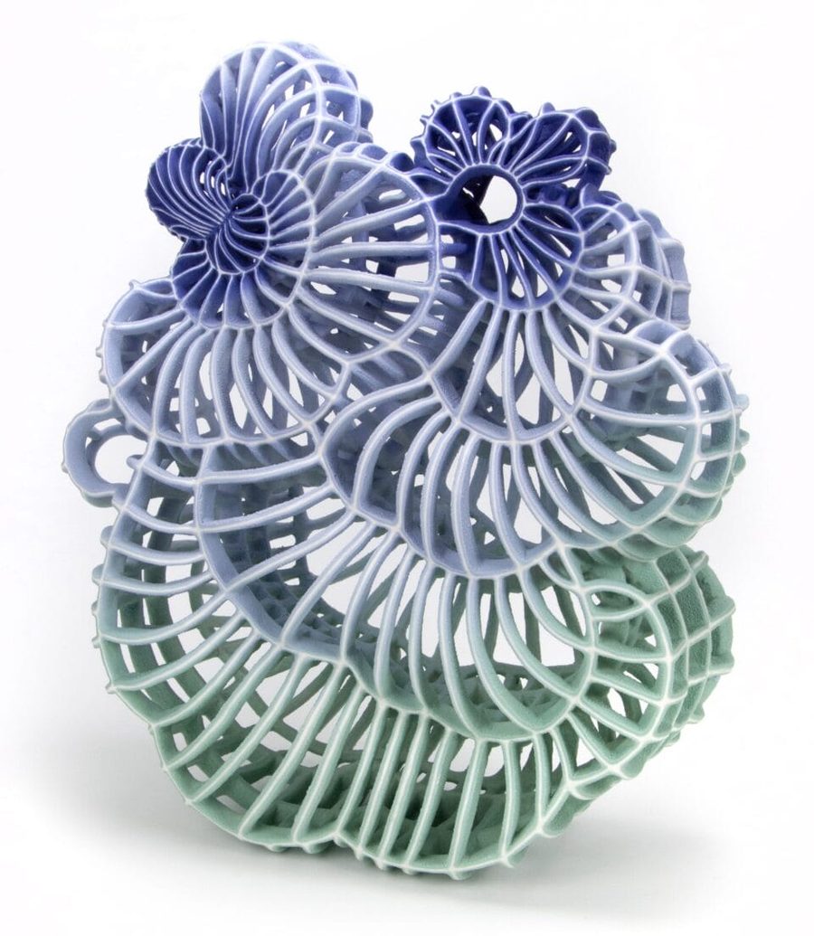 an abstract ceramic sculpture with a blue and green gradient, 2025