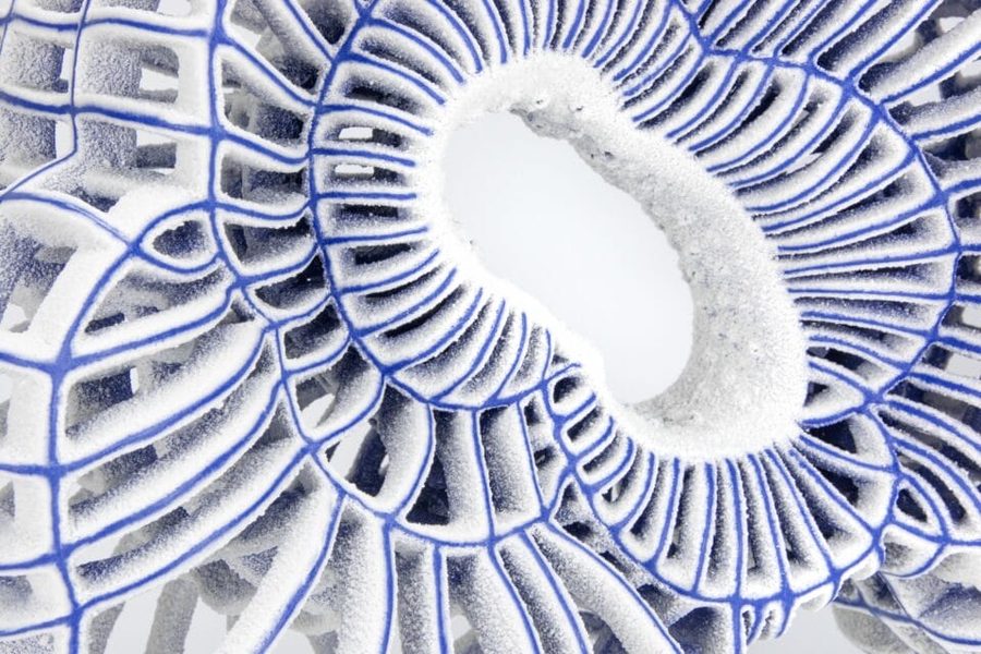 a detail of an abstract ceramic sculpture with blue porcelai, 2025